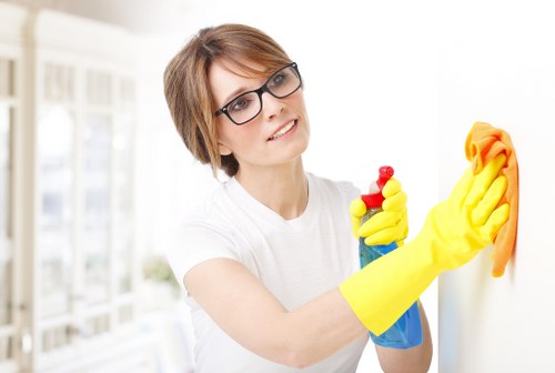 Carpet cleaner wearing PPE during a safe cleaning task