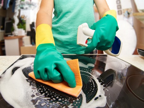 Middle stage of a carpet cleaning complaint review with notes and documents